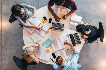 a decorative element: sitting at a table and studying students